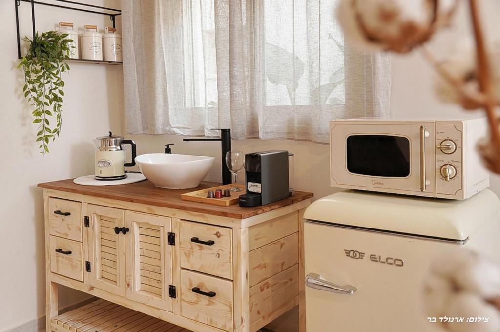 Kuchyň nebo kuchyňský kout v ubytování Anise Suites