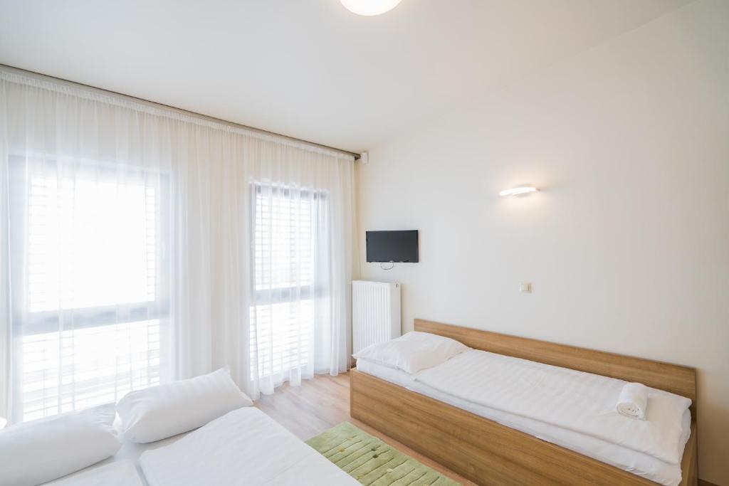 Posteľ alebo postele v izbe v ubytovaní Silver Lodge Siófok