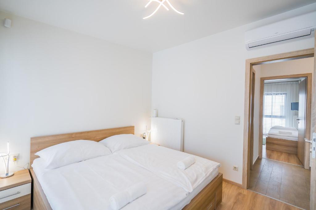 Posteľ alebo postele v izbe v ubytovaní Silver Lodge Siófok