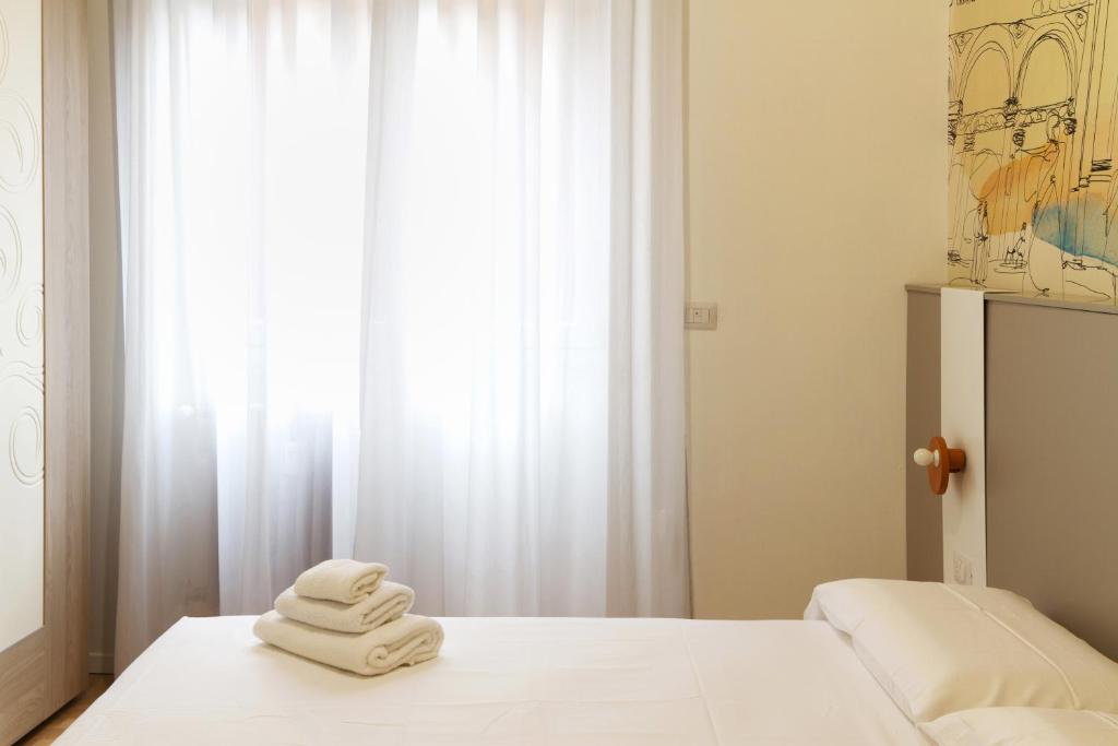 Łóżko lub łóżka w pokoju w obiekcie JOIVY Smart 1-bed with modern amenities