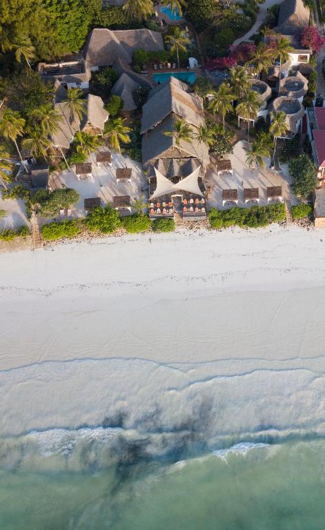 an aerial view of a beach with houses and the ocean at Villa Kiva Boutique Hotel in Matemwe