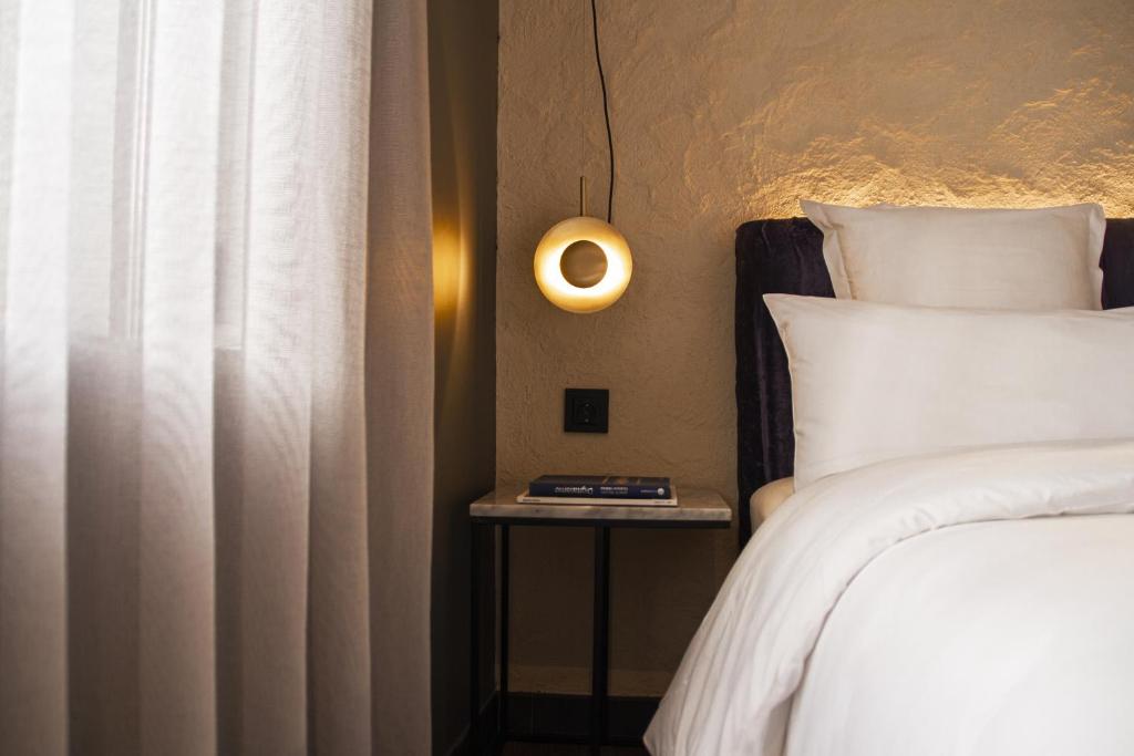 A bed or beds in a room at Letoh Letoh Gran Vía