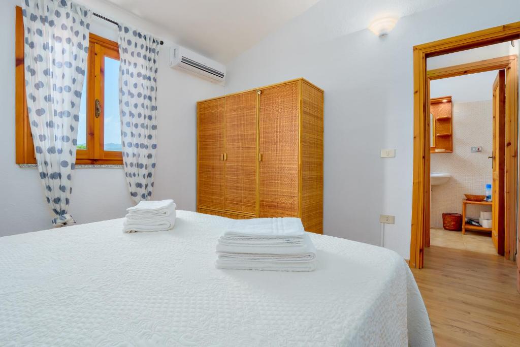 Łóżko lub łóżka w pokoju w obiekcie Casa Asfodeli
