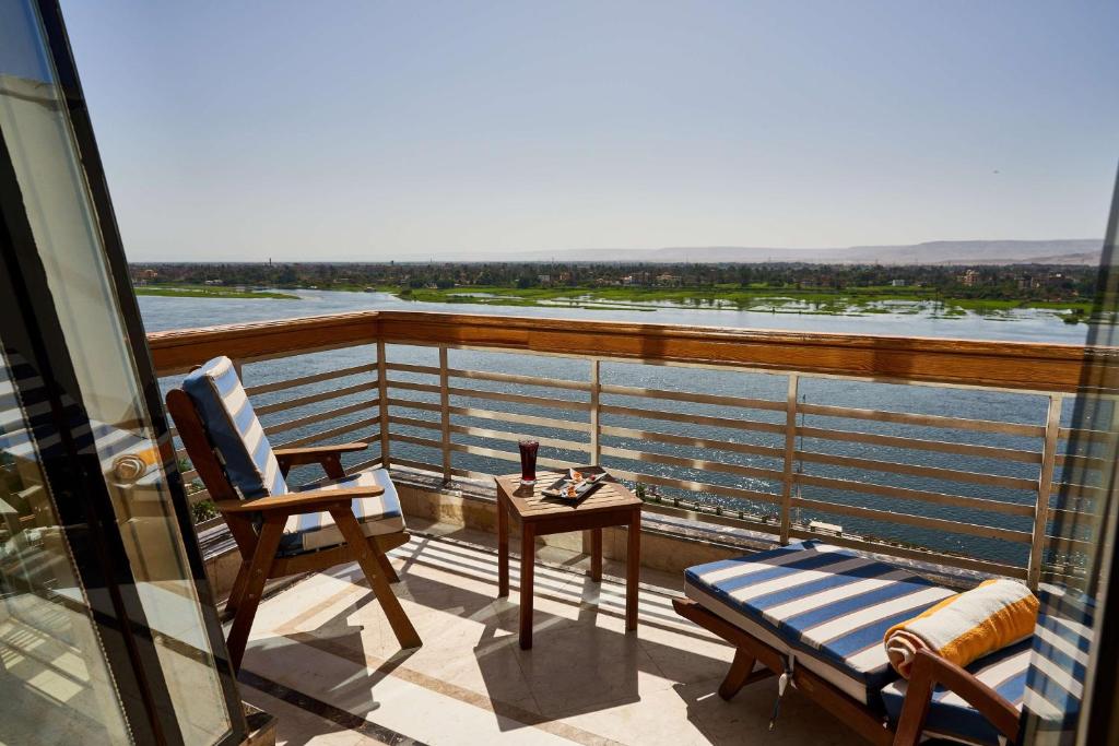 a balcony with a view of the water at Sonesta St. George Hotel - Convention Center in Luxor