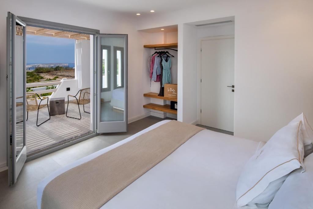 Postel nebo postele na pokoji v ubytování La Ponta Villas & Suites
