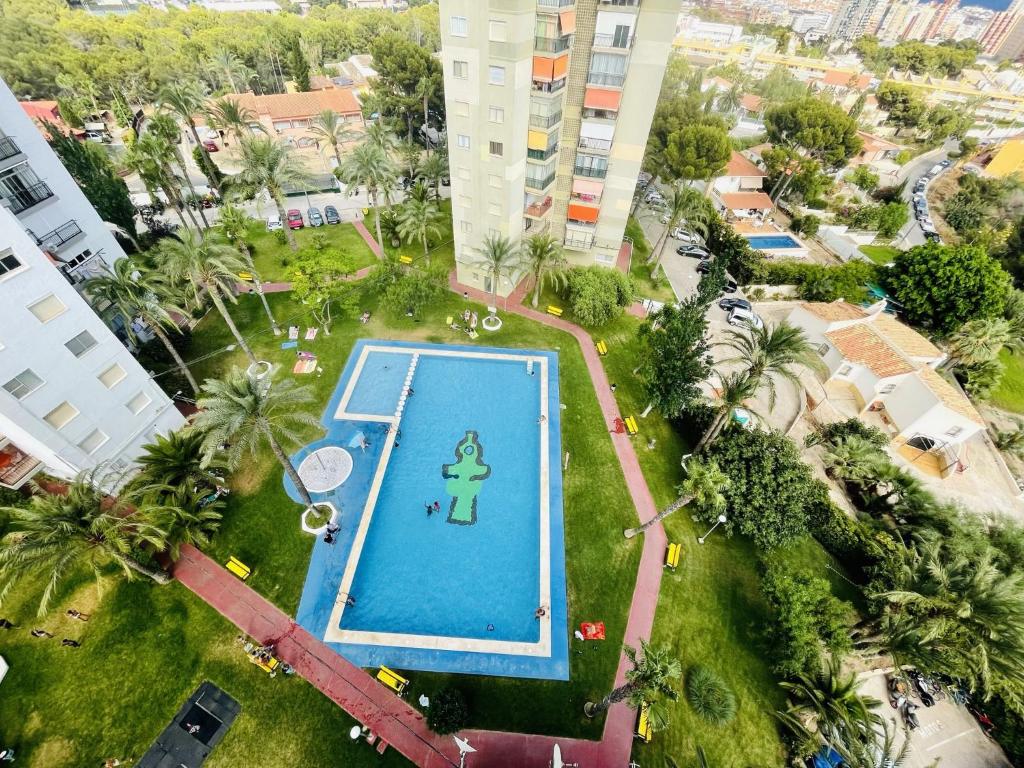 an overhead view of a swimming pool in a city at A697 - Club Médico - 2004 Finestrat s.l. in Benidorm