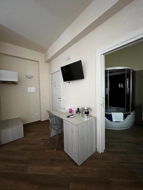 Telewizja i/lub zestaw kina domowego w obiekcie All’Anoneto B&B