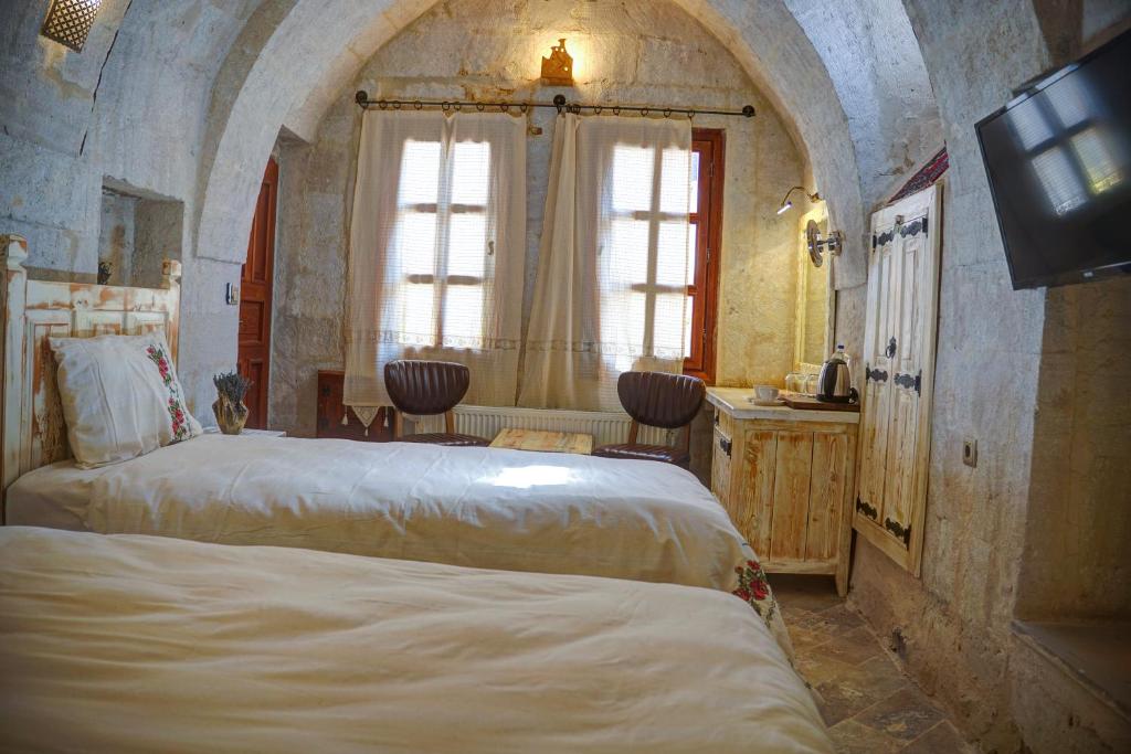 Postel nebo postele na pokoji v ubytování Aşk-ı Nare Cave Hotel - Swimming Pool & SPA