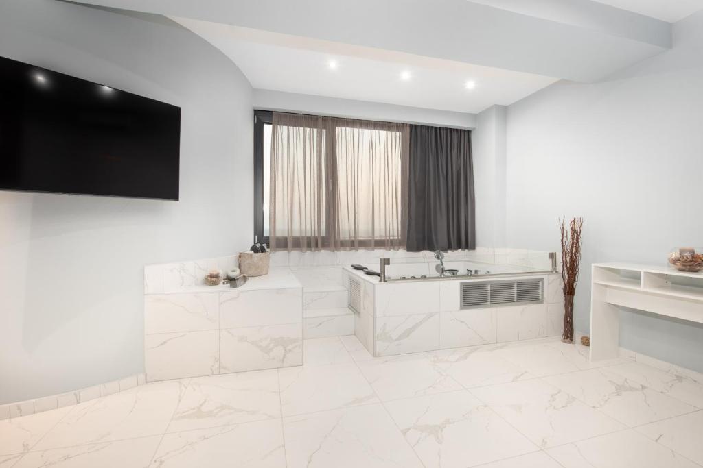 Televízia a/alebo spoločenská miestnosť v ubytovaní Sea & City LUXURY SUITE