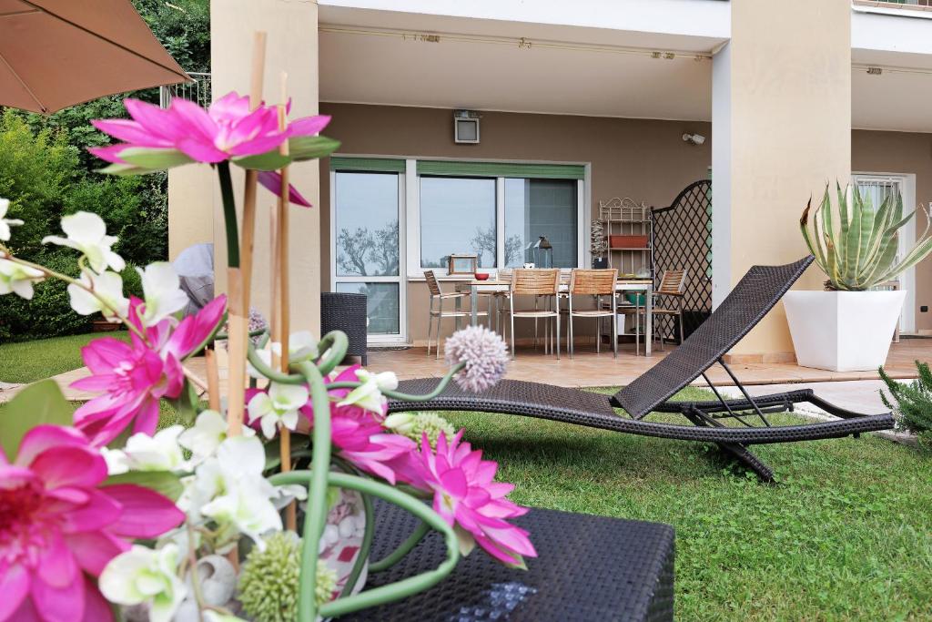 A garden outside Dani Apartment garda lake view