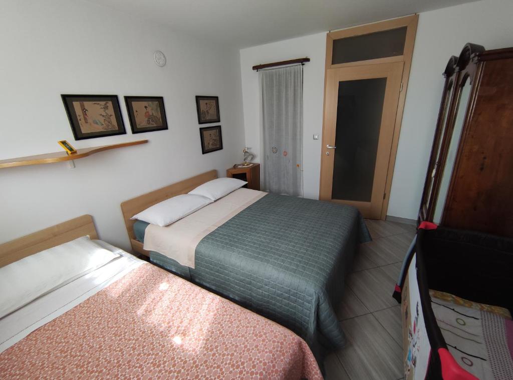 Postel nebo postele na pokoji v ubytování Apartments Leni