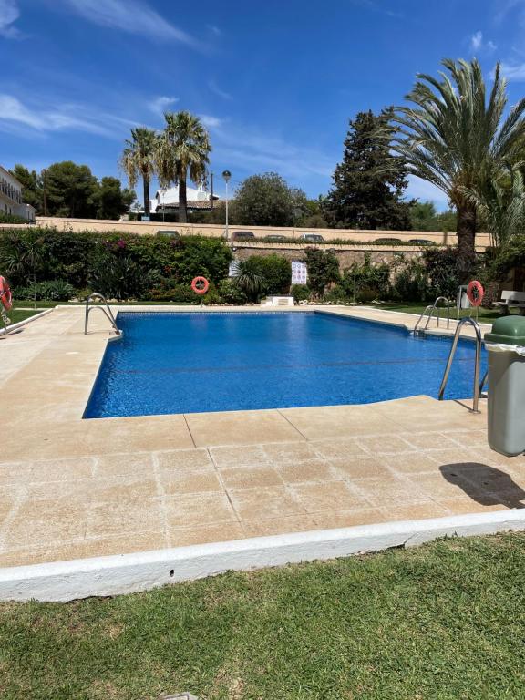 a large swimming pool in a yard with at La Cala de Mijas Urb Alcantara in La Cala de Mijas