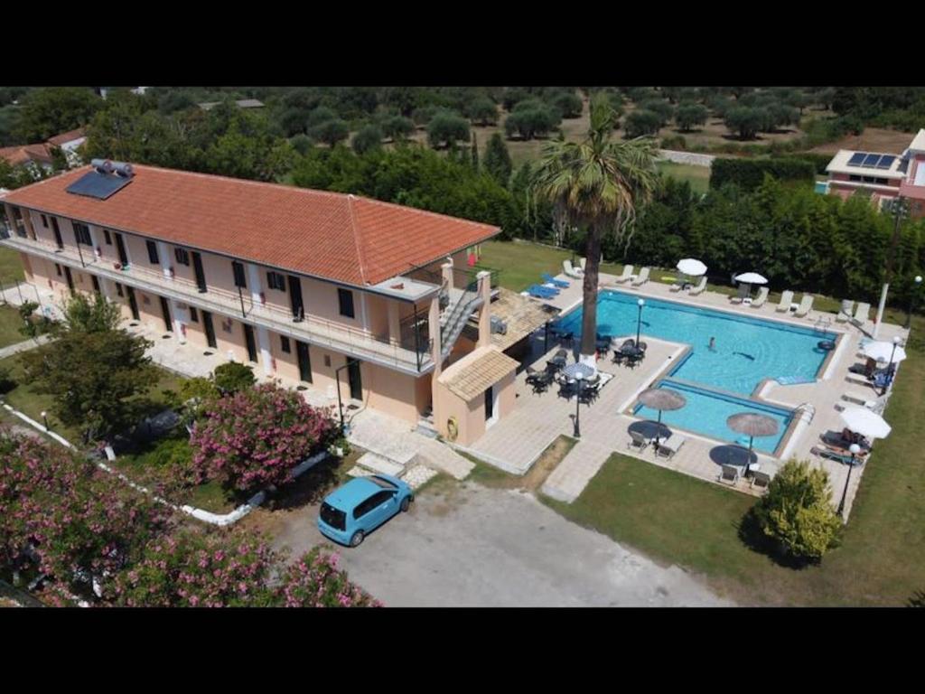 an aerial view of a house with a swimming pool at Room in Apartment - Banos Apartments And Swimming Pool in Roda