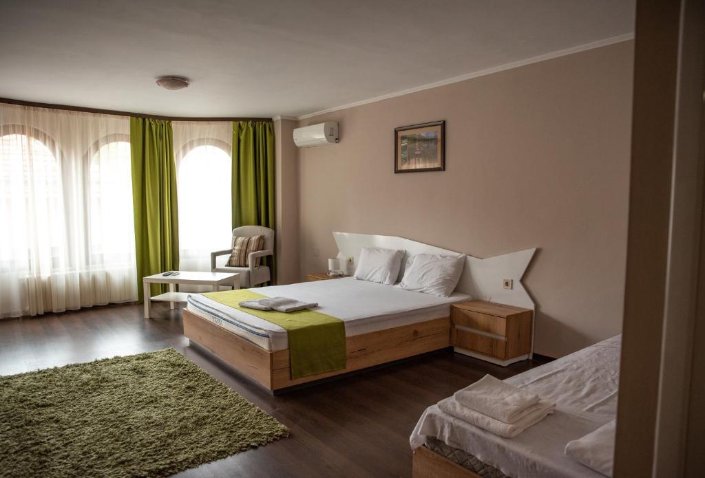 Postel nebo postele na pokoji v ubytování Hotel Oppium Restaurant & Garden