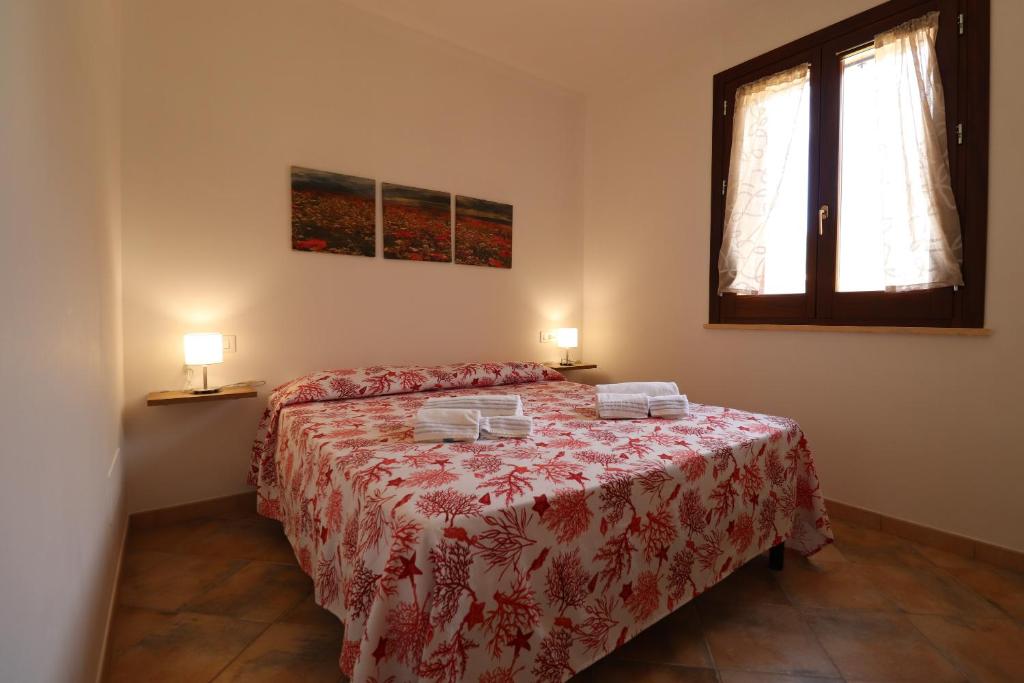 Posteľ alebo postele v izbe v ubytovaní casa Vincenzo