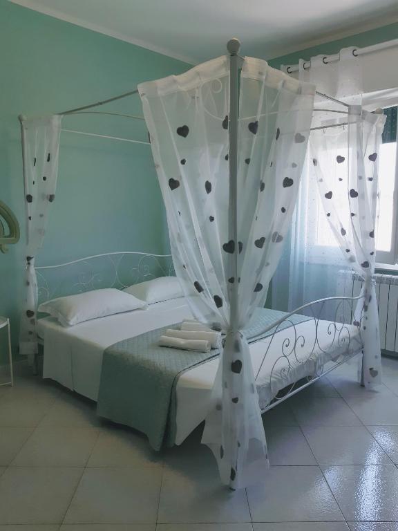 Postel nebo postele na pokoji v ubytování Nonna Anita Palace Narni