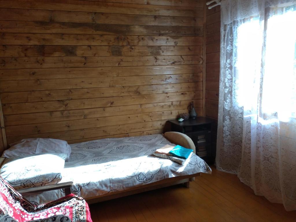 A bed or beds in a room at Семейный домик под ключ у моря в Новом Афоне!