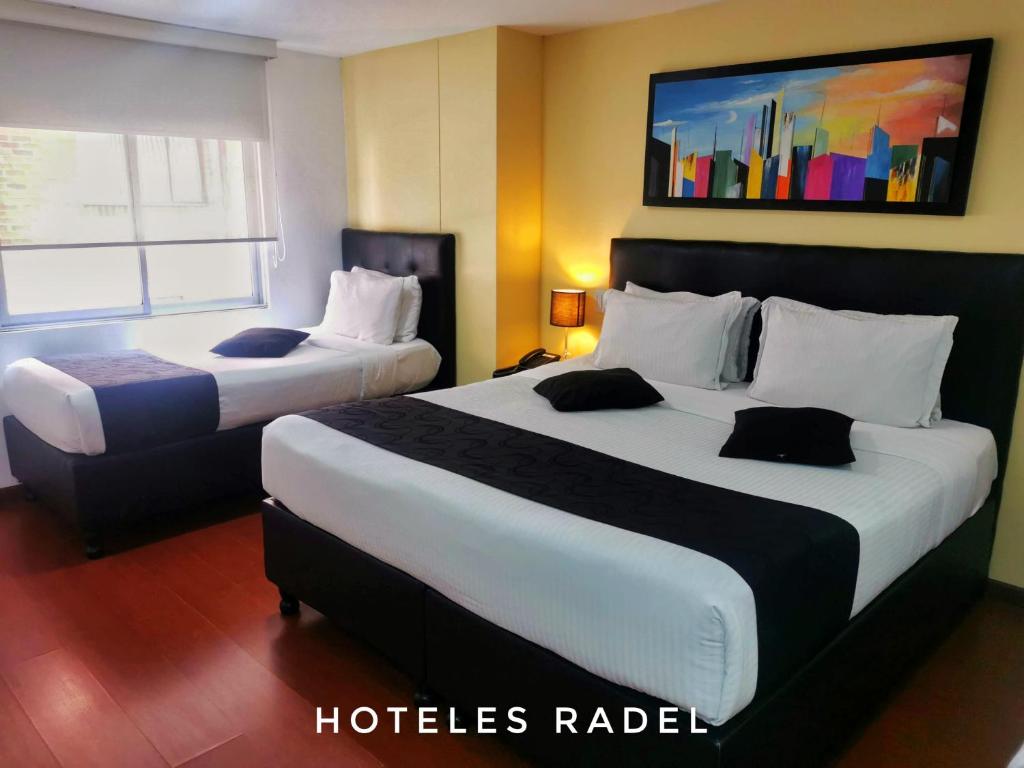 Postel nebo postele na pokoji v ubytování Hotel Radel Superior