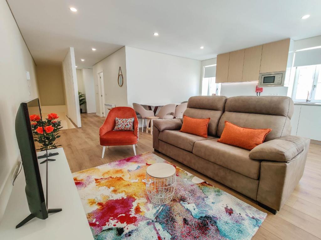 a living room with a couch and a table at Senhora dos Mares - Apartment in Ribeira in Viana do Castelo