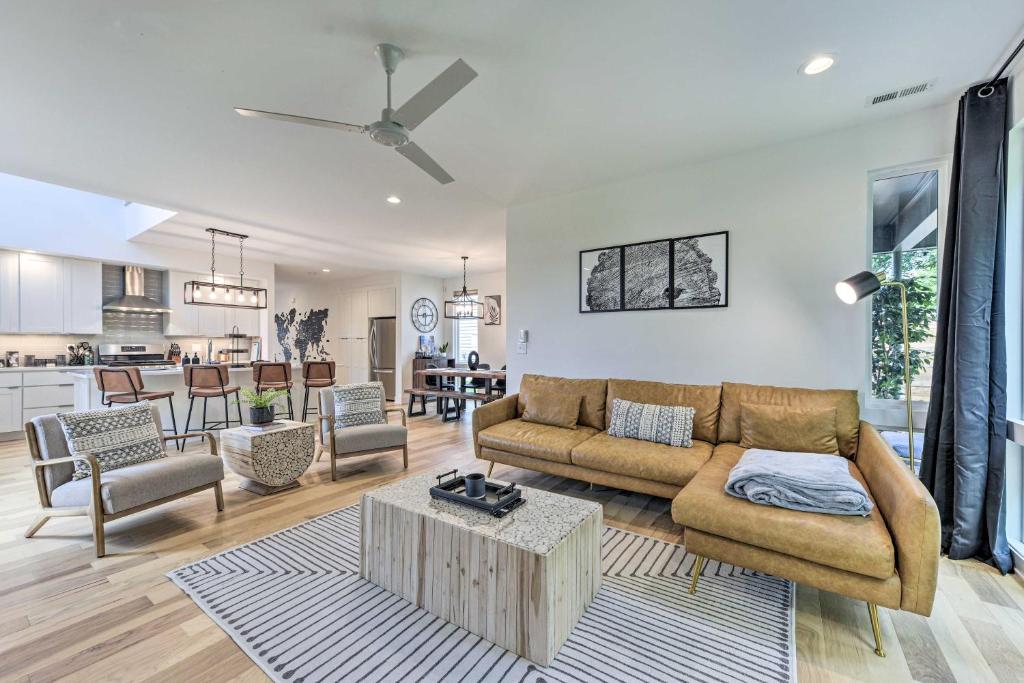 a living room with a couch and a table at Contemporary Raleigh Home about 2 Mi to Downtown! in Raleigh