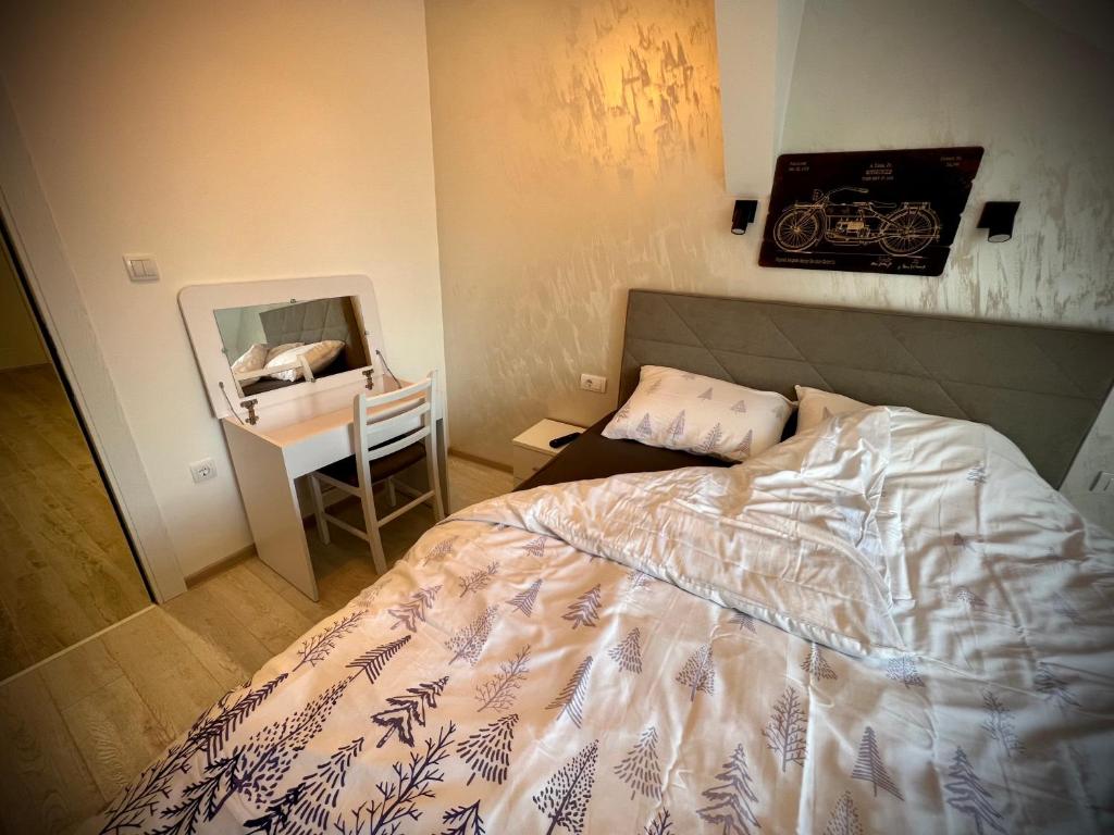 Postel nebo postele na pokoji v ubytování Lux Apartman Rudnik
