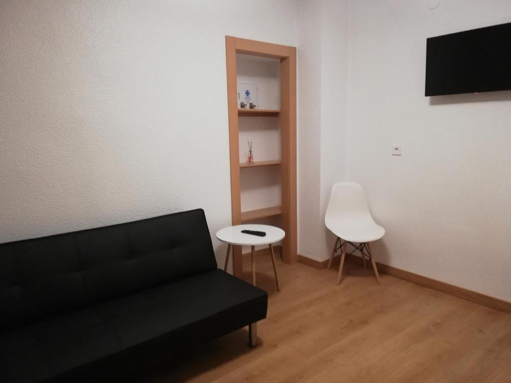 TV a/nebo společenská místnost v ubytování Hostal Rosa