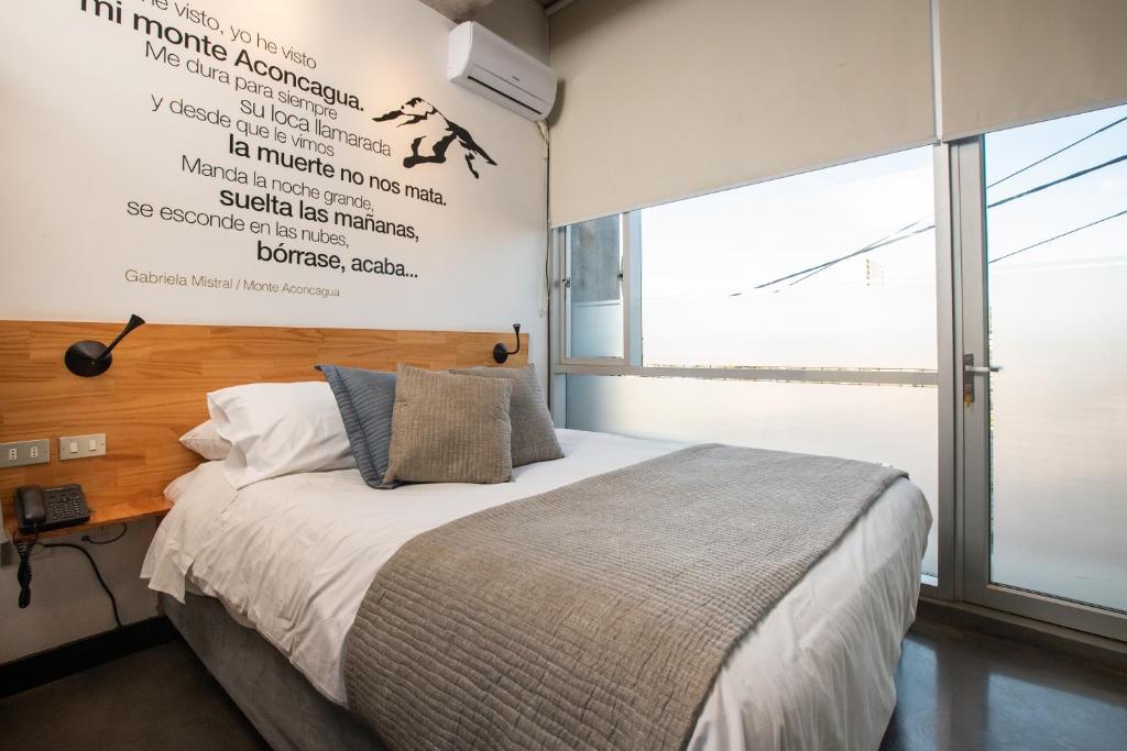 Postel nebo postele na pokoji v ubytování Verso Hotel