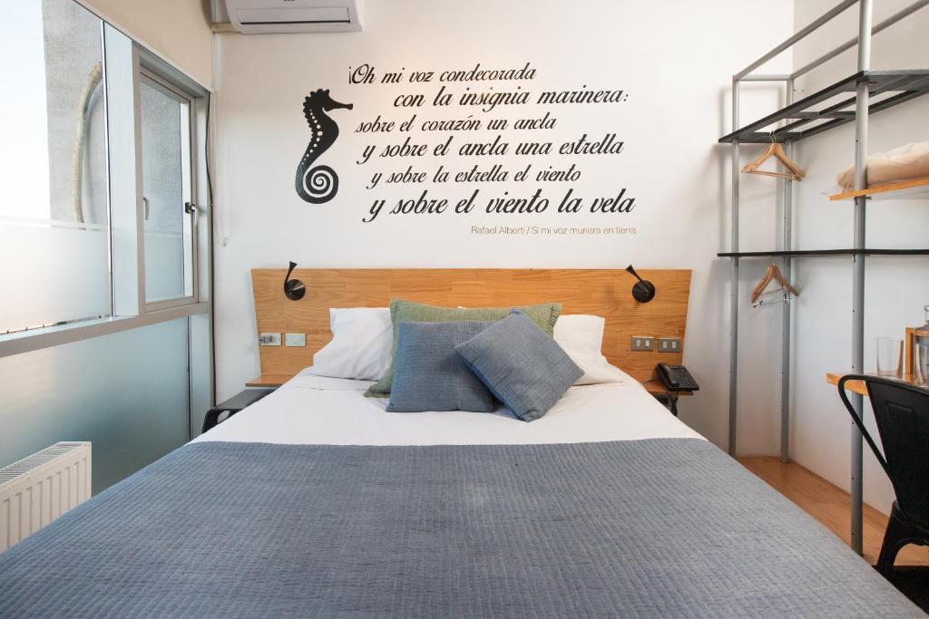 Postel nebo postele na pokoji v ubytování Verso Hotel