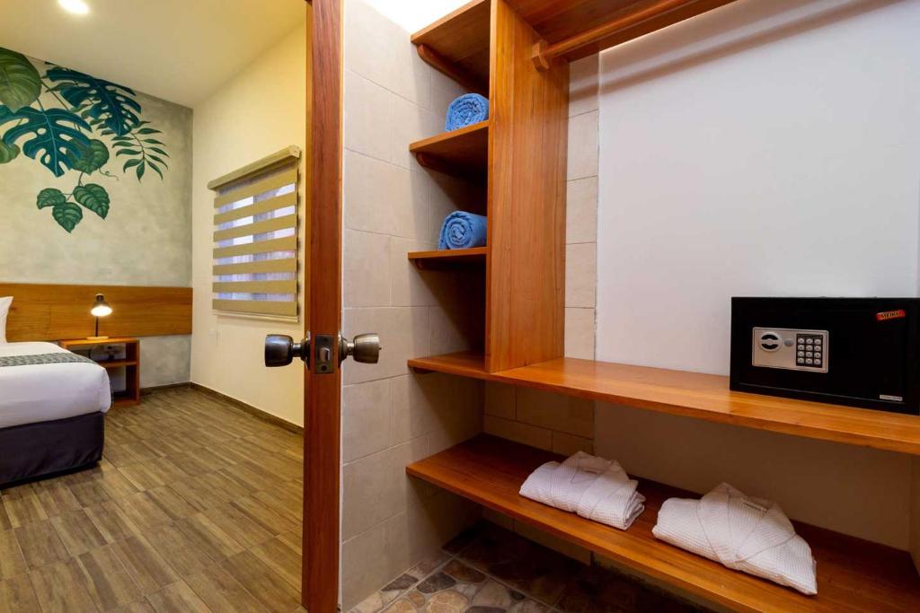 Postel nebo postele na pokoji v ubytování Plaza Luna Suites