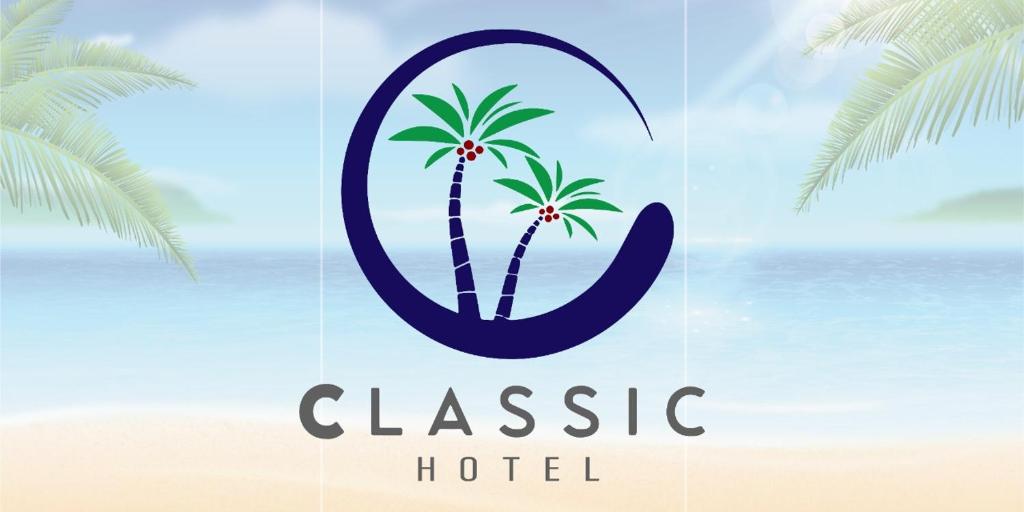 a sign for a hotel with a palm tree at فندق كلاسيك in Aqaba