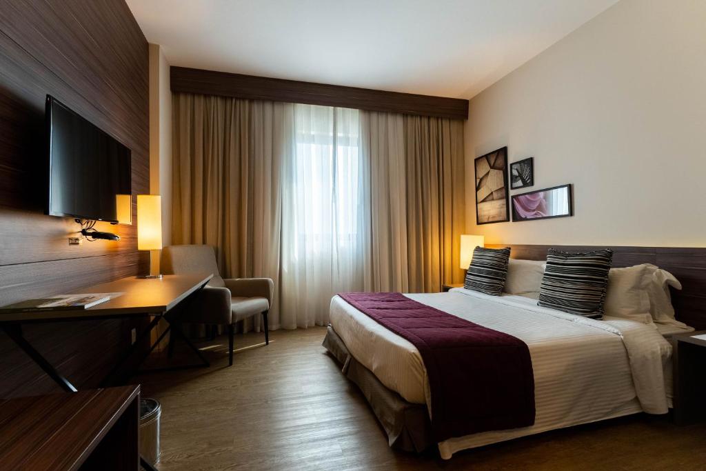 Cama ou camas em um quarto em Royal Palm Tower Anhanguera
