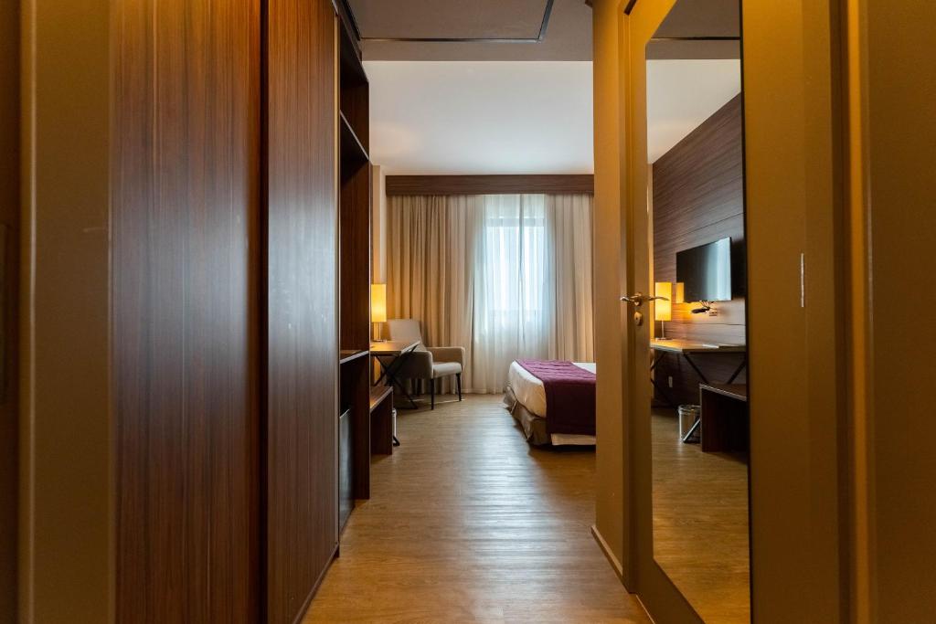 Cama ou camas em um quarto em Royal Palm Tower Anhanguera