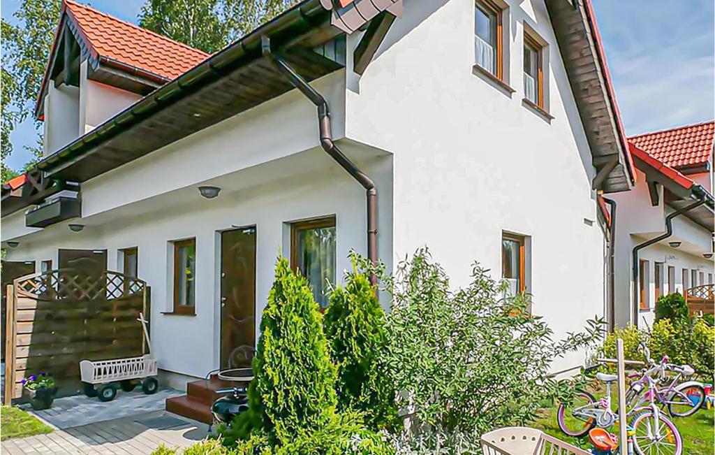 a white house with a rain gutter at Awesome Apartment In Bobolin With Wifi in Bobolin