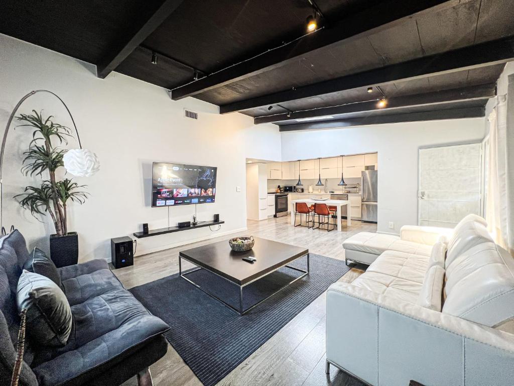 a living room with a couch and a table at Spacious 2BR unit in an Outstanding Location in Los Angeles