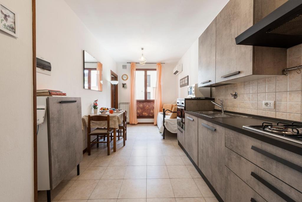 A kitchen or kitchenette at Castelnuovo Flat with Elevator and Free Parking