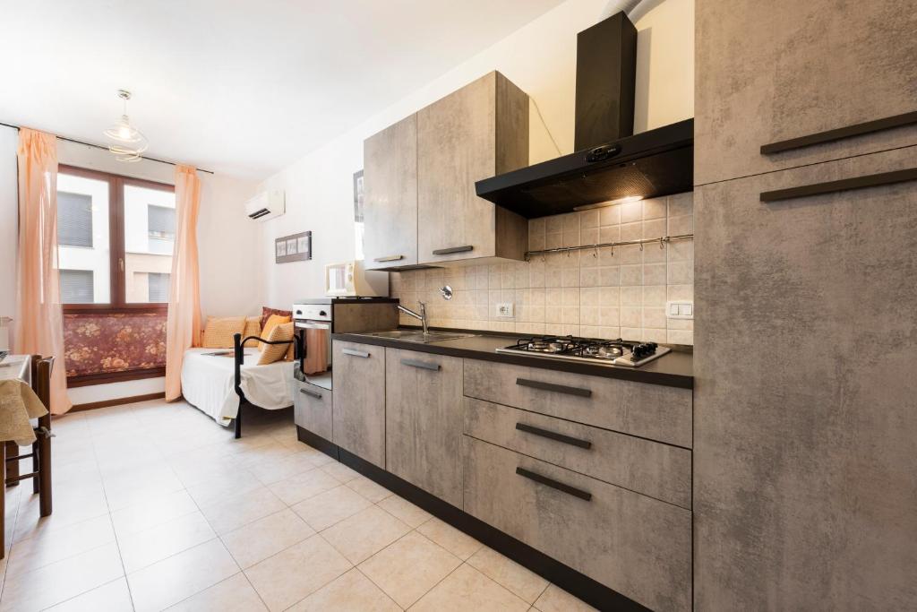 A kitchen or kitchenette at Castelnuovo Flat with Elevator and Free Parking