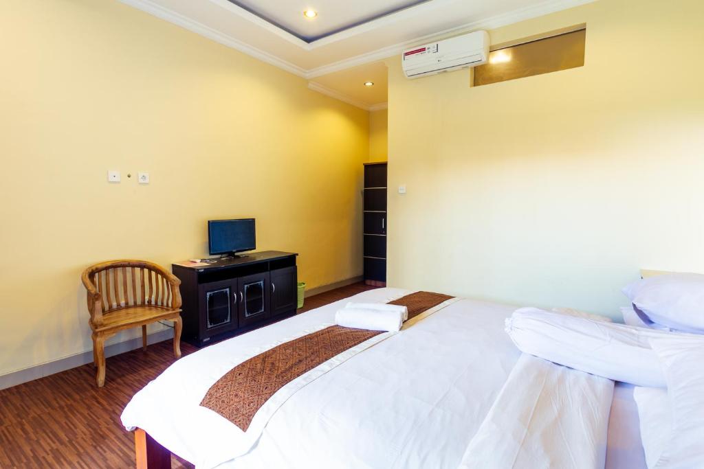 Postel nebo postele na pokoji v ubytování Sakura Guest House