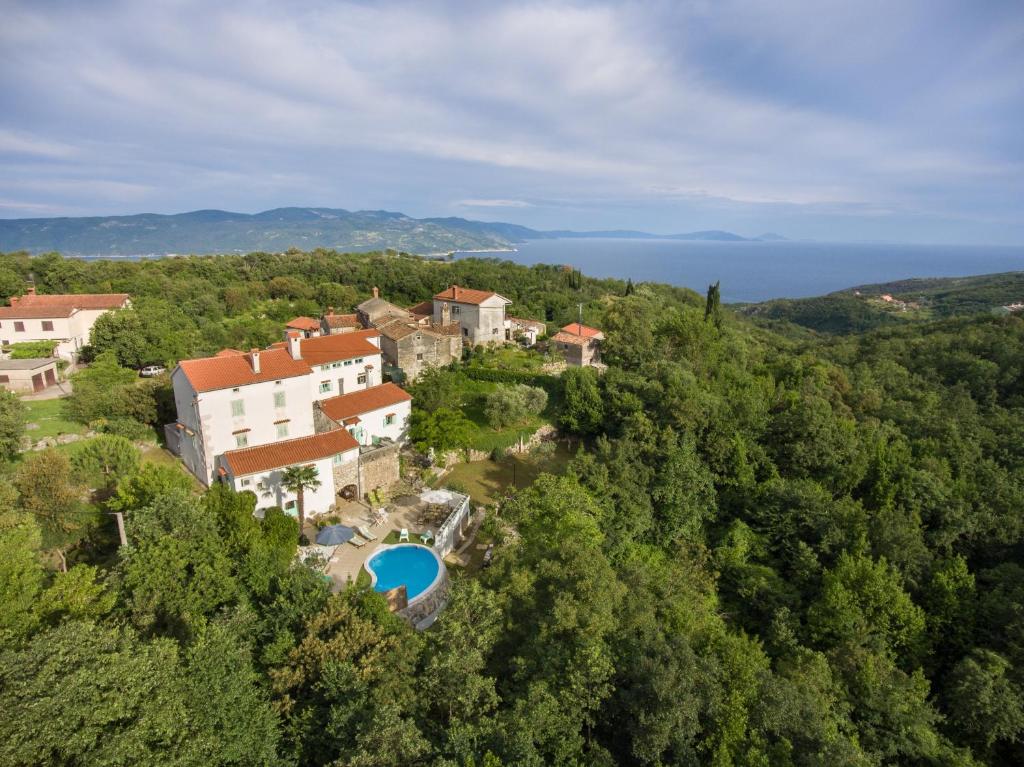 an aerial view of a house in the forest at Family friendly house with a swimming pool Zagore, Opatija - 17924 in Mošćenička Draga