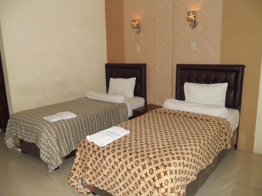 Postel nebo postele na pokoji v ubytování Permata Land Hotel & Resort