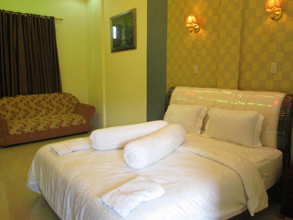 Postel nebo postele na pokoji v ubytování Permata Land Hotel & Resort