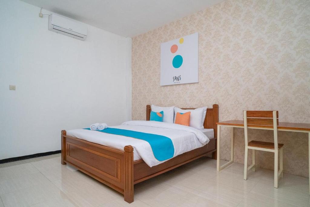 Postel nebo postele na pokoji v ubytování Sans Hotel Queen Batu
