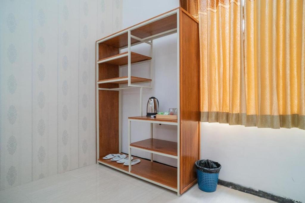 Postel nebo postele na pokoji v ubytování Sans Hotel Queen Batu