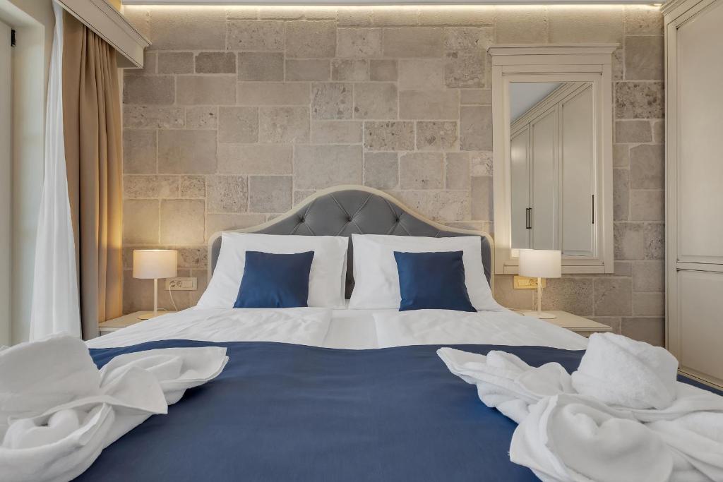 Postel nebo postele na pokoji v ubytování Heritage Hotel Liberan