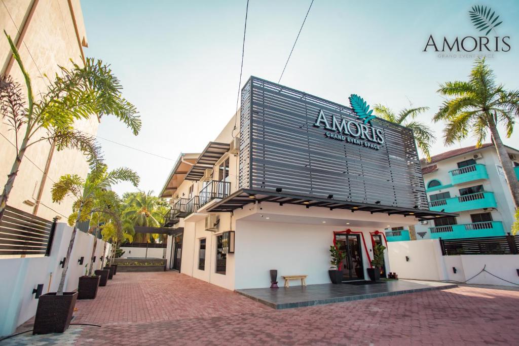 a building with a sign on the side of it at Amoris Grand Event Space in Muar