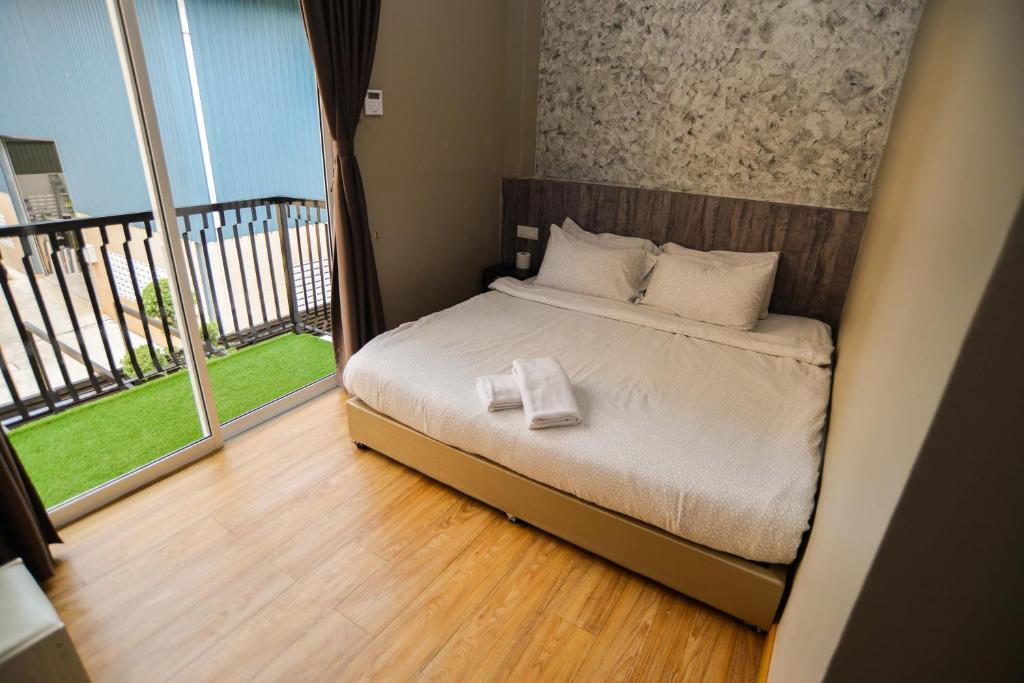 Postel nebo postele na pokoji v ubytování Amoris Grand Event Space