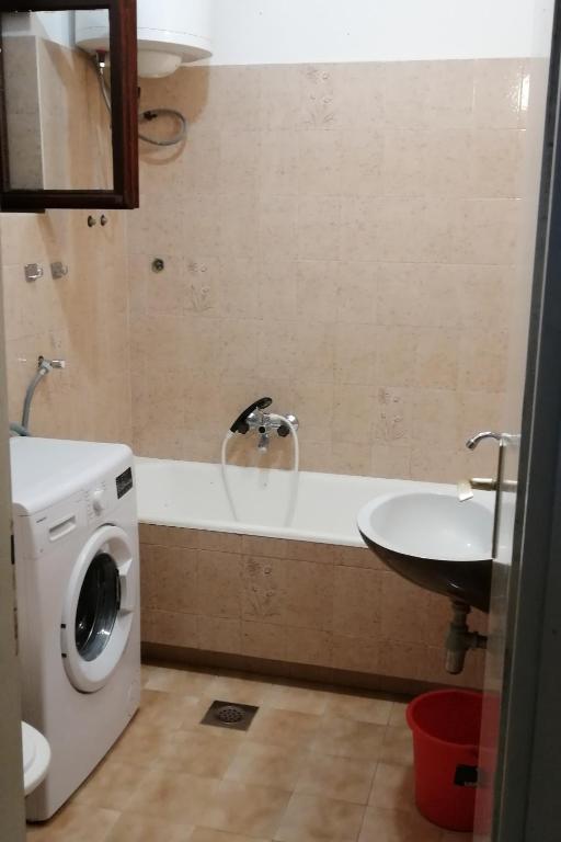 a bathroom with a washing machine and a sink at Apartments by the sea Srima - Vodice, Vodice - 18470 in Vodice