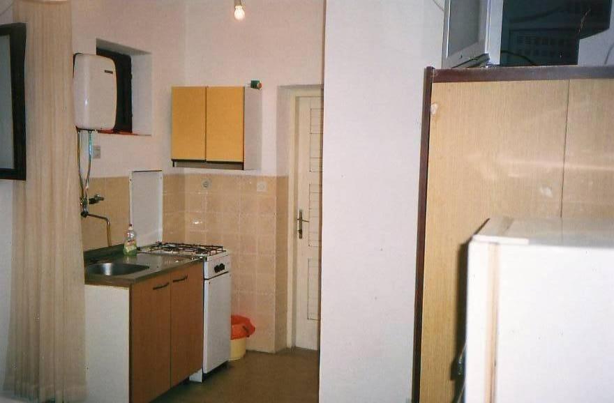 a small kitchen with a sink and a stove at Apartments by the sea Srima - Vodice, Vodice - 18470 in Vodice