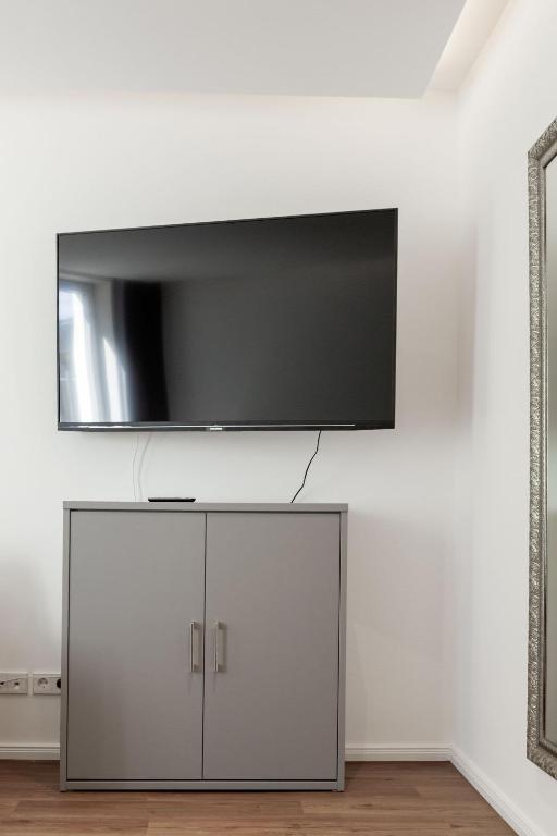 TV a/nebo společenská místnost v ubytování LIGHTHOUSE APPARTEMENTS