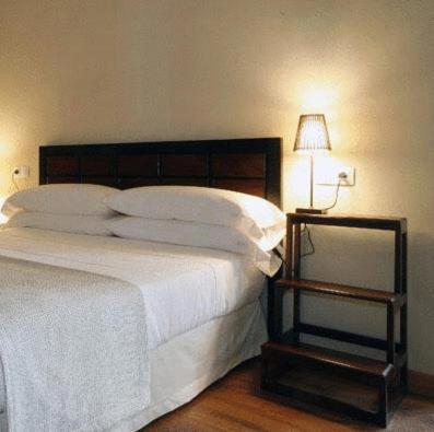 Postel nebo postele na pokoji v ubytování Hotel el Jardín de Eugenia