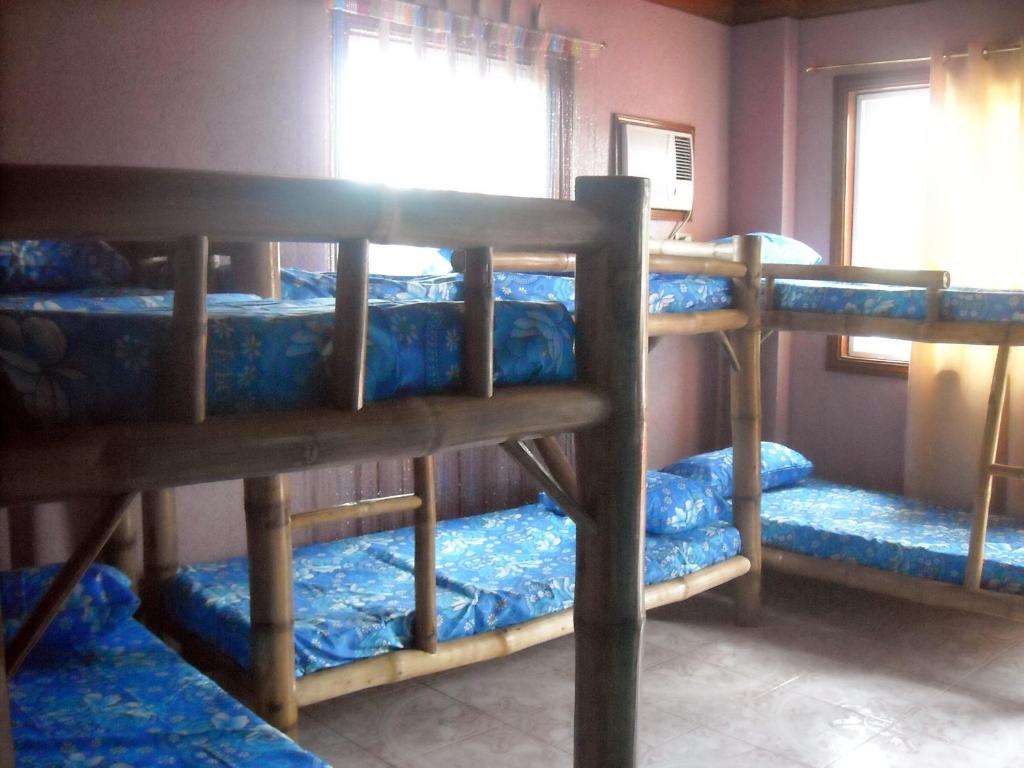 Postel nebo postele na pokoji v ubytování Cebu Guest Inn